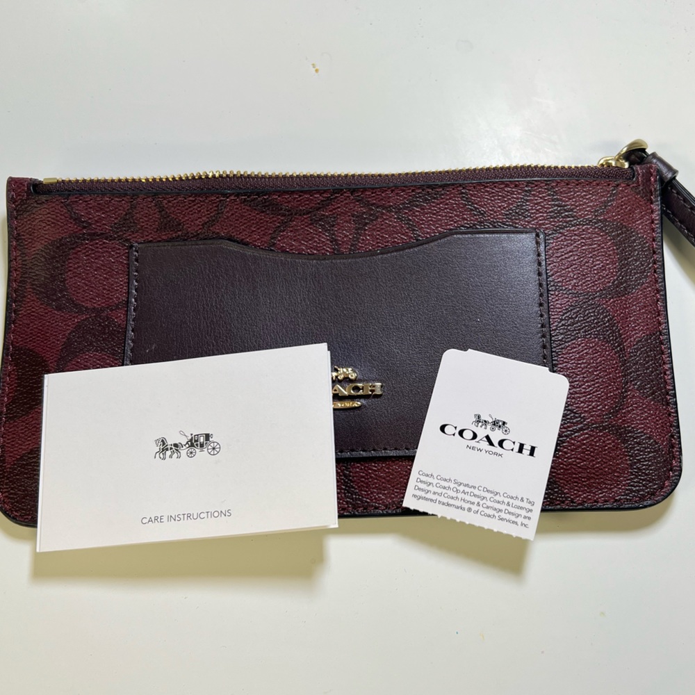 Coach credit card wristlet. Maroon and gold.